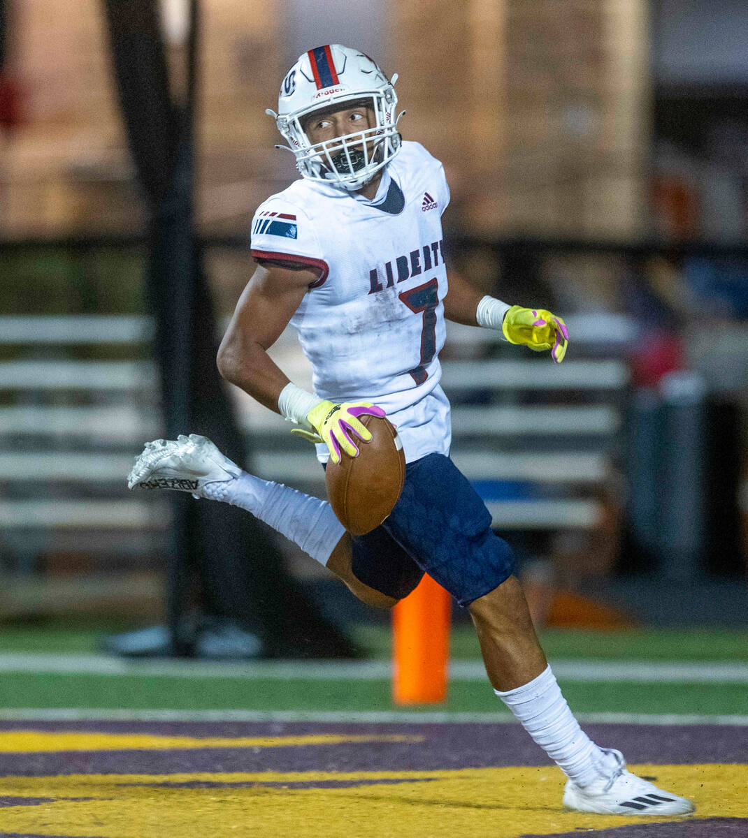 Liberty wide receiver Jayden Robertson (7) looks looks back on another touchdown reception over ...