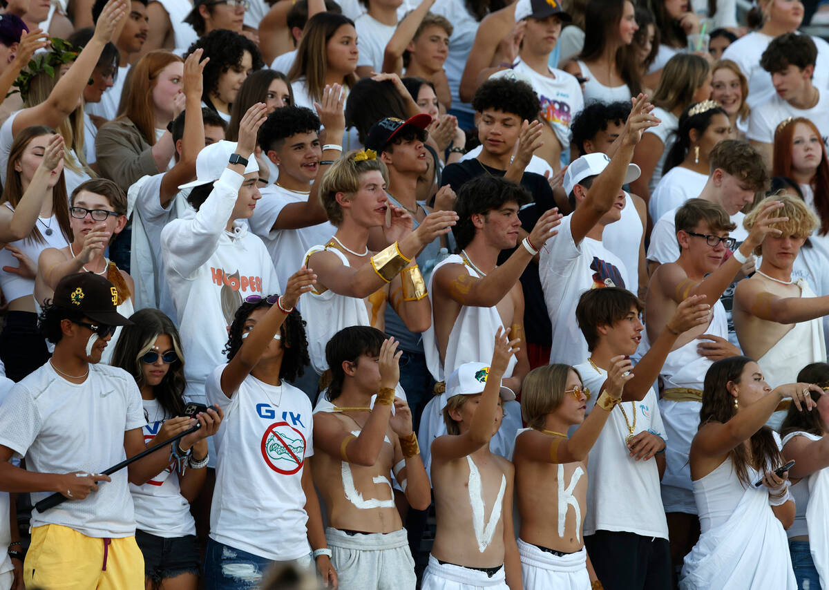 Basic High's fans cheer their team during the first half of a football game against Basic High ...