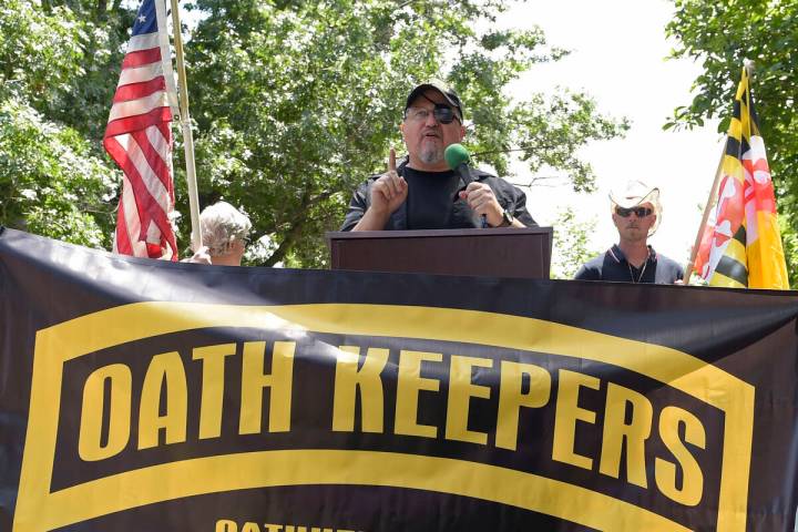 FILE - Stewart Rhodes, founder of the Oath Keepers, center, speaks during a rally outside the W ...