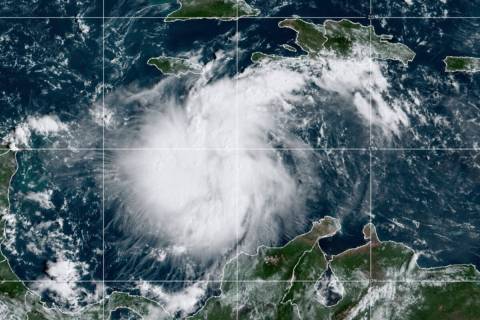 This satellite image provided by the National Oceanic and Atmospheric Administration shows Trop ...