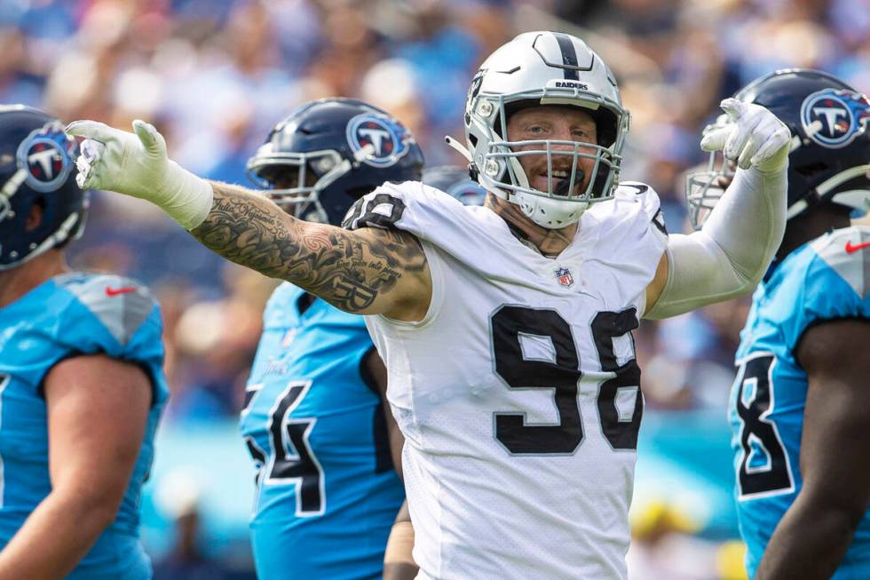 Raiders defensive end Maxx Crosby (98) signals after the Tennessee Titans were penalized during ...