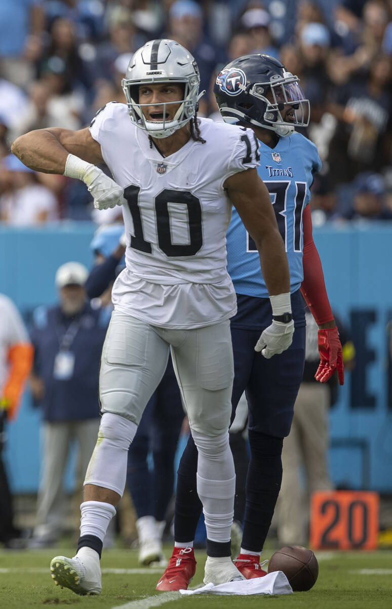 Raiders wide receiver Mack Hollins (10) celebrates a catch over Tennessee Titans safety Kevin B ...