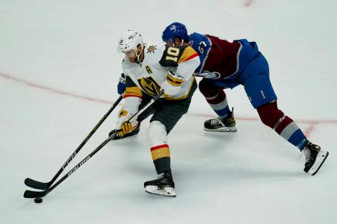 Vegas Golden Knights' Nicolas Roy vies for possession against Colorado Avalanche's Keaton Middl ...