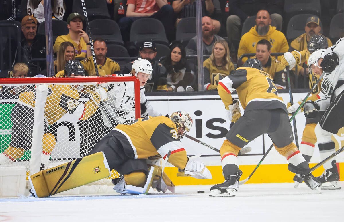 Golden Knights goaltender Logan Thompson (36) stops the puck against the Los Angeles Kings duri ...