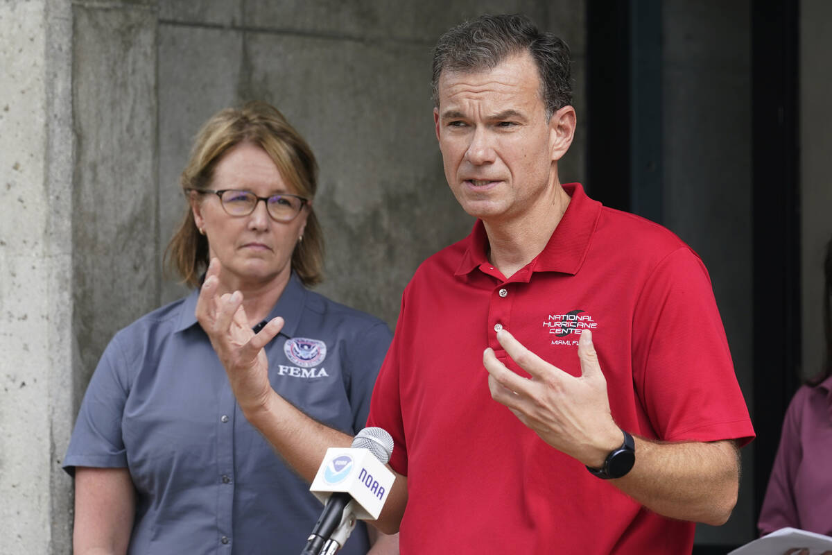 FEMA administrator Deanne Criswell, left, listens to Jamie Rhome, the Acting Director of the Na ...