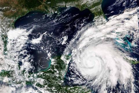 This Sept. 26, 2022, satellite image released by NASA shows Hurricane Ian growing stronger as i ...