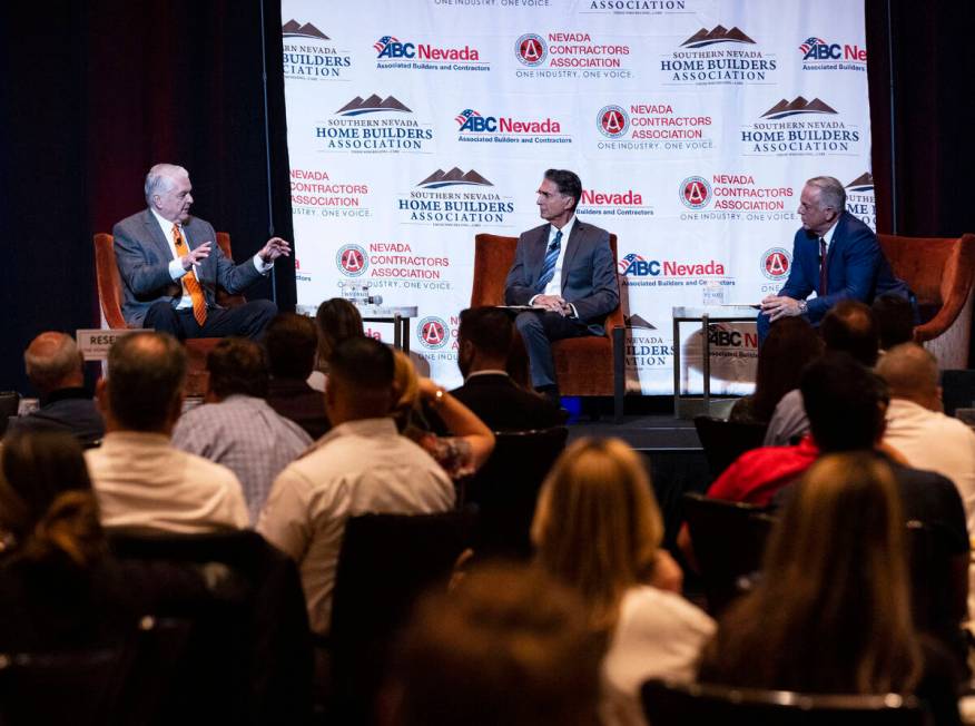 Gov. Steve Sisolak, left, speaks as moderator Mitch Fox, president and CEO of the Nevada Broadc ...