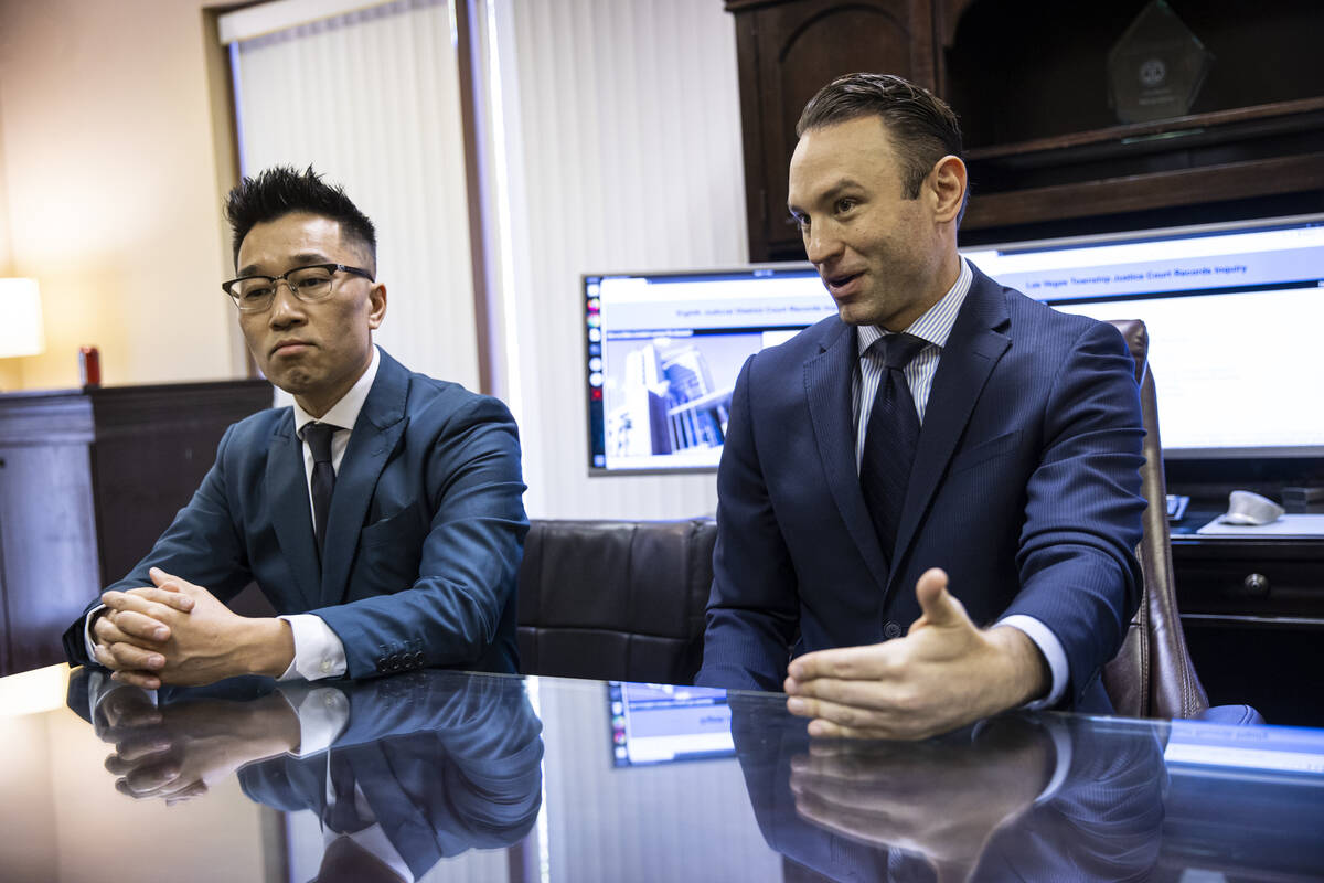 Sttorney Warren Geller, right, talks about the case of Zeng Lin, left, who was accused of sexua ...