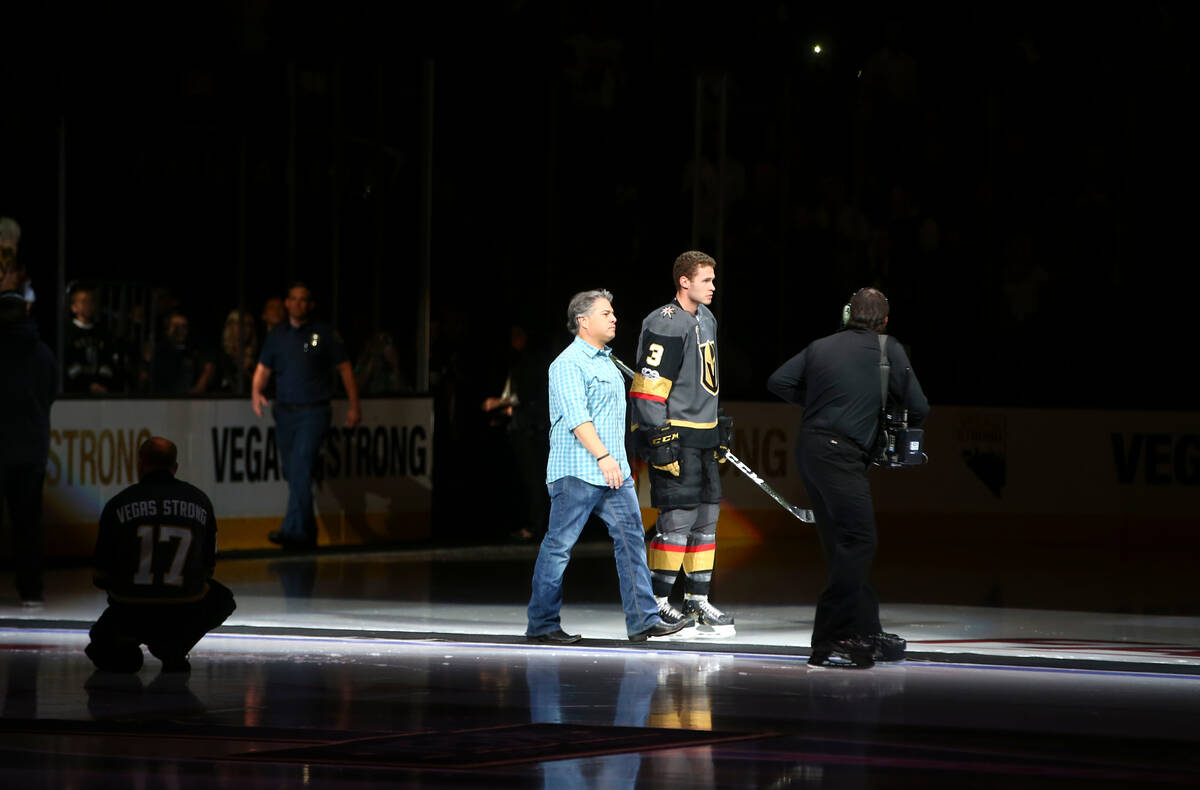 Vegas Golden Knights' Brayden McNabb (3) is introduced with a first responder before playing th ...