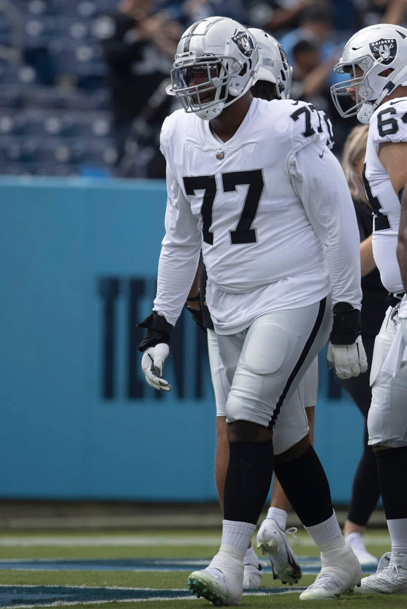 Raiders offensive tackle Thayer Munford Jr. (77) works on the field before an NFL game against ...