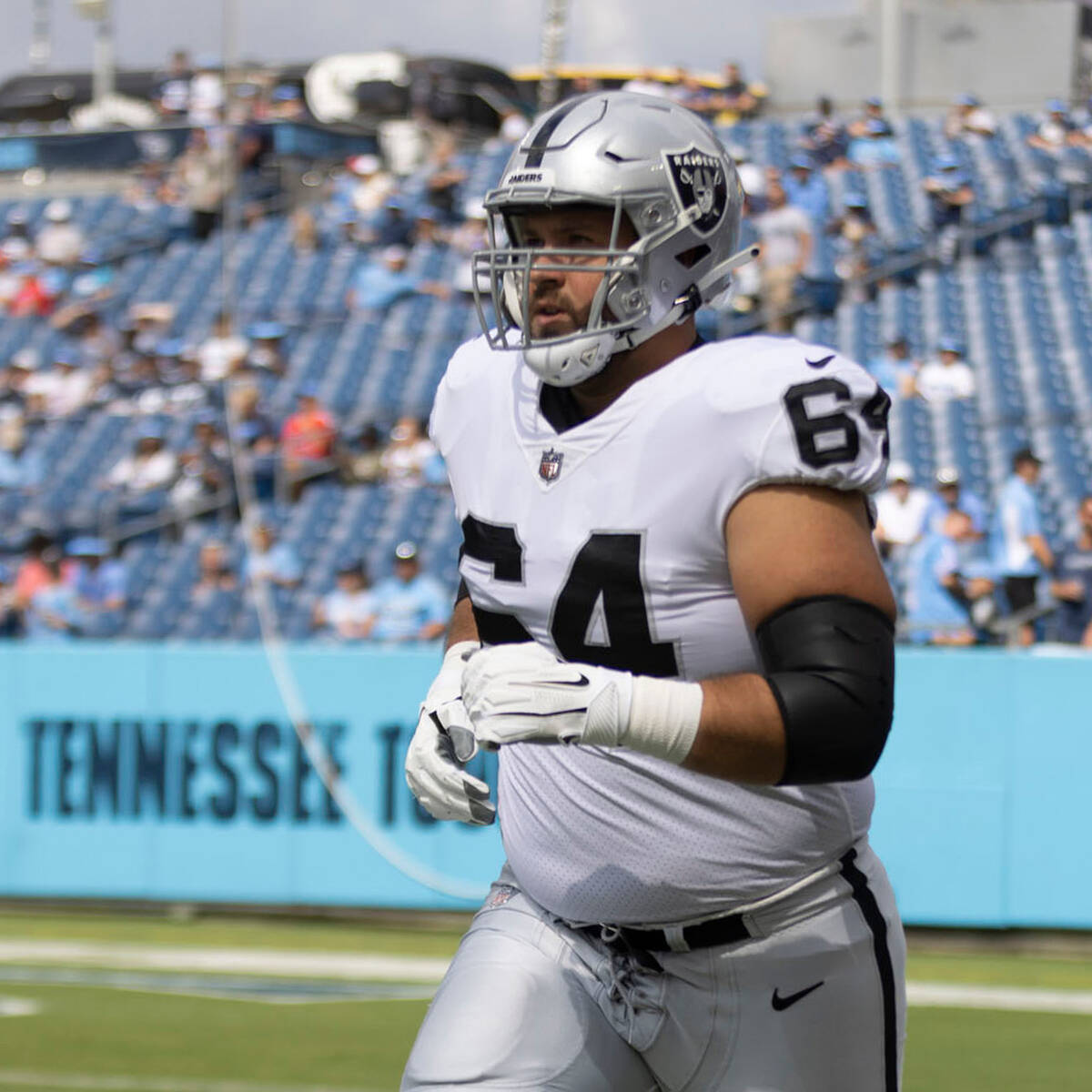Raiders guard Alex Bars (64) runs on the field before an NFL game against the Tennessee Titans ...