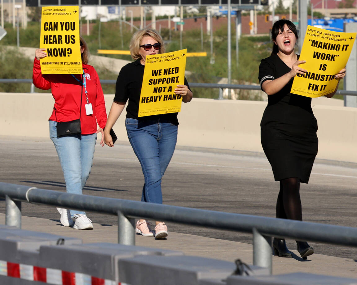 United Airlines flight attendants and supporters picket outside Terminal 3 at Harry Reid Intern ...