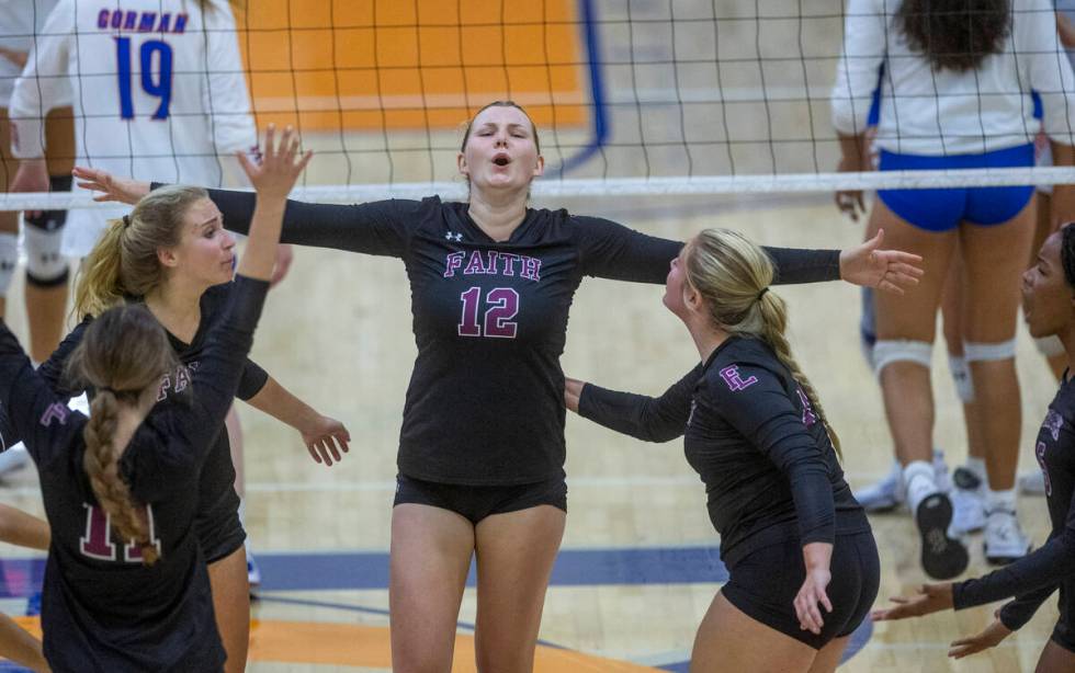 Faith Lutheran's Delaney Wilson (12) celebrates a win over Bishop Gorman during the second set ...