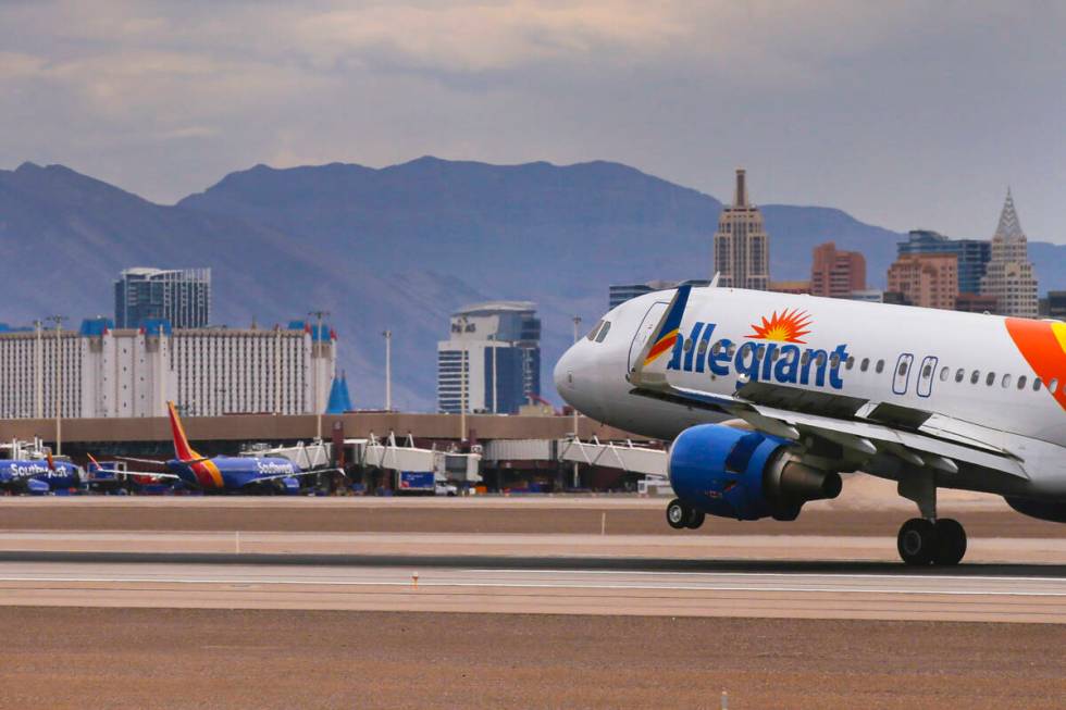 An Allegiant Air plane lands at Harry Reid International Airport on Tuesday, July 26, 2022, in ...