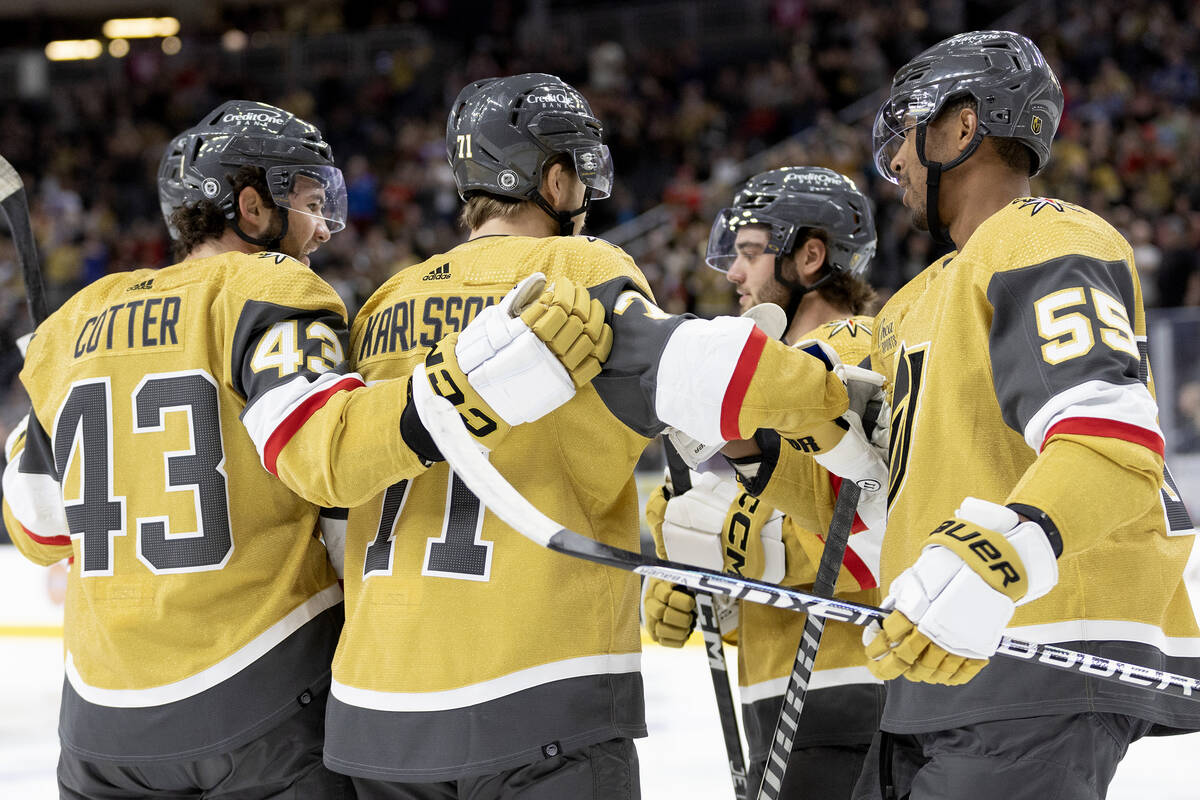 Golden Knights center Paul Cotter (43), defenseman Lukas Cormier (40), center right, and right ...