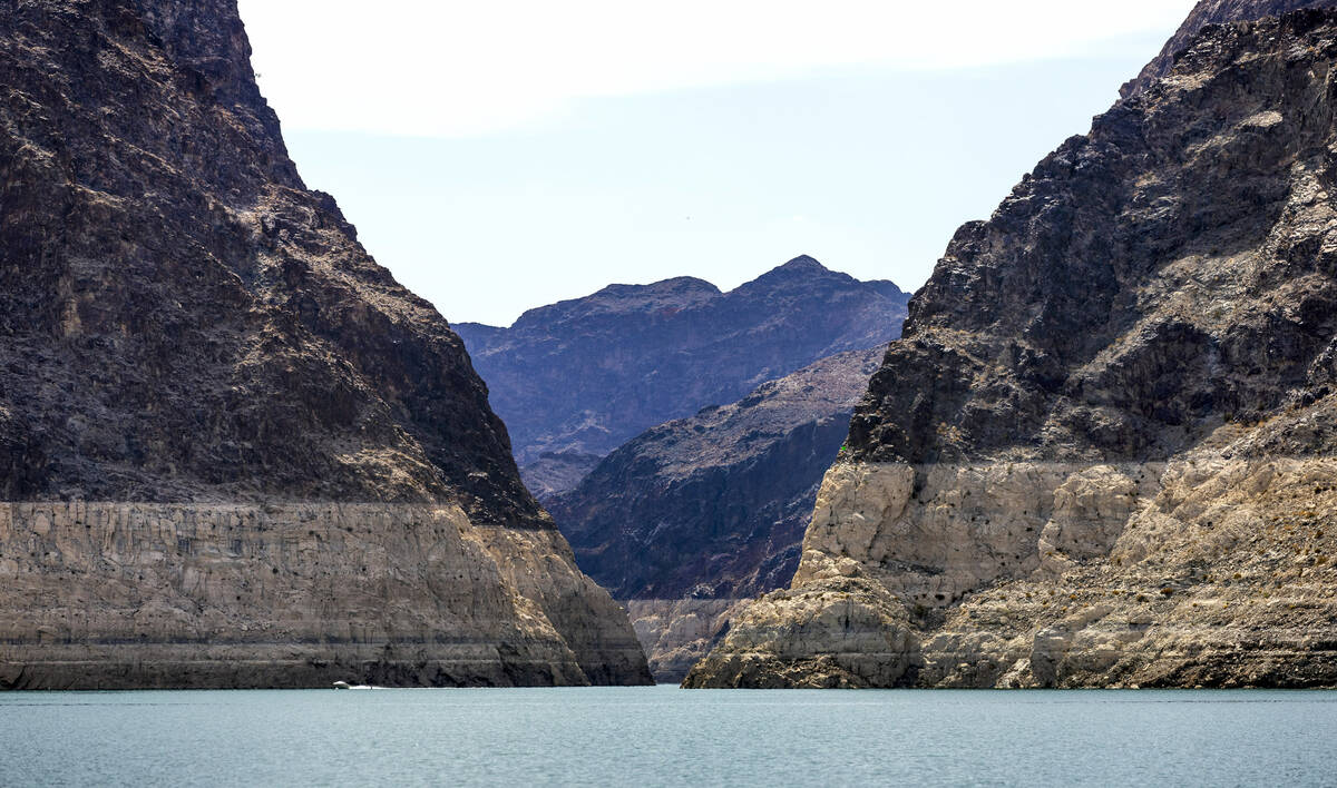 A motor boat exits the Boulder Canyon area at the Lake Mead National Recreation Area as the wat ...