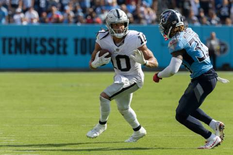 Raiders wide receiver Mack Hollins (10) makes a catch with Tennessee Titans cornerback Chris Ja ...