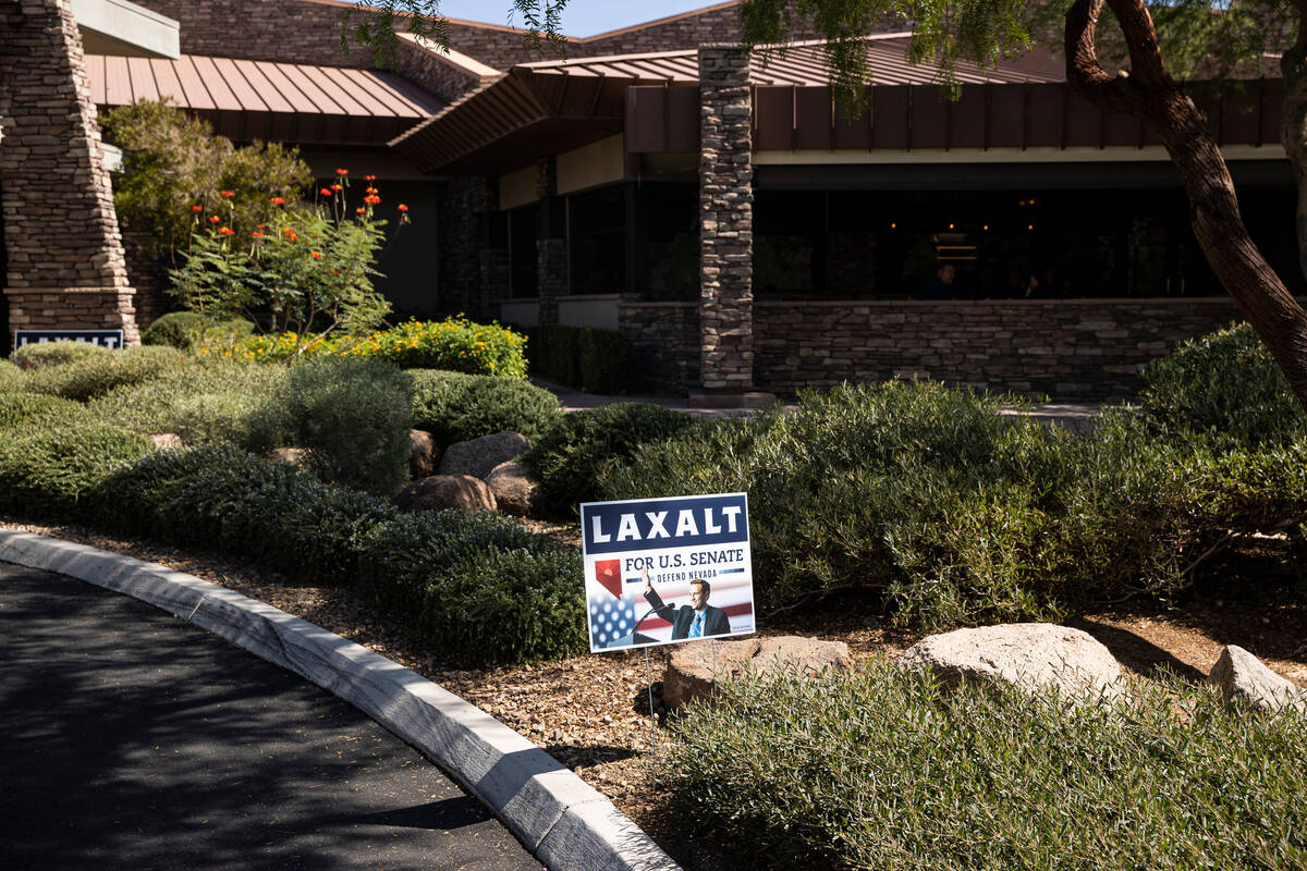 Signs in support of Nevada Republican U.S. Senate candidate Adam Laxalt are seen before a campa ...