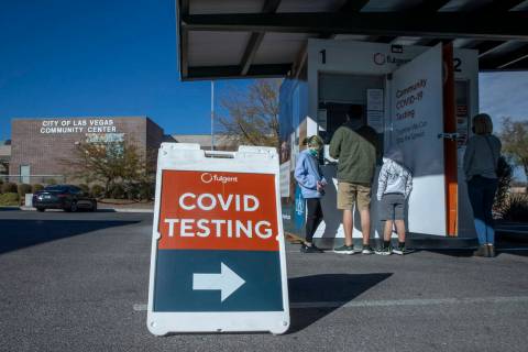 People wait and are served for COVID-19 testing at the Veterans Memorial Community Center on Tu ...