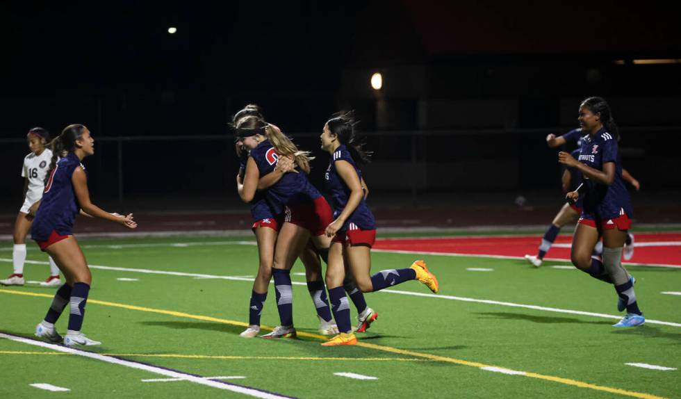 Liberty players celebrate a goal against Desert Oasis during a soccer game at Liberty High Scho ...