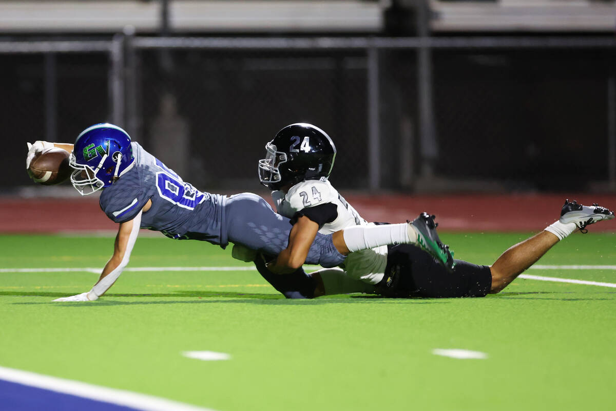 Green Valley's Ben Byington (85) dives for more yardage in the first half of a football game ag ...