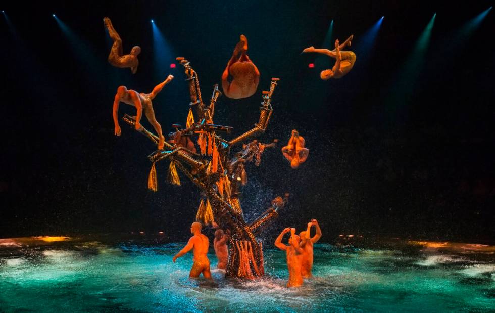 Performers leap into the water from a large tree structure during the 7:00 pm performance of "L ...