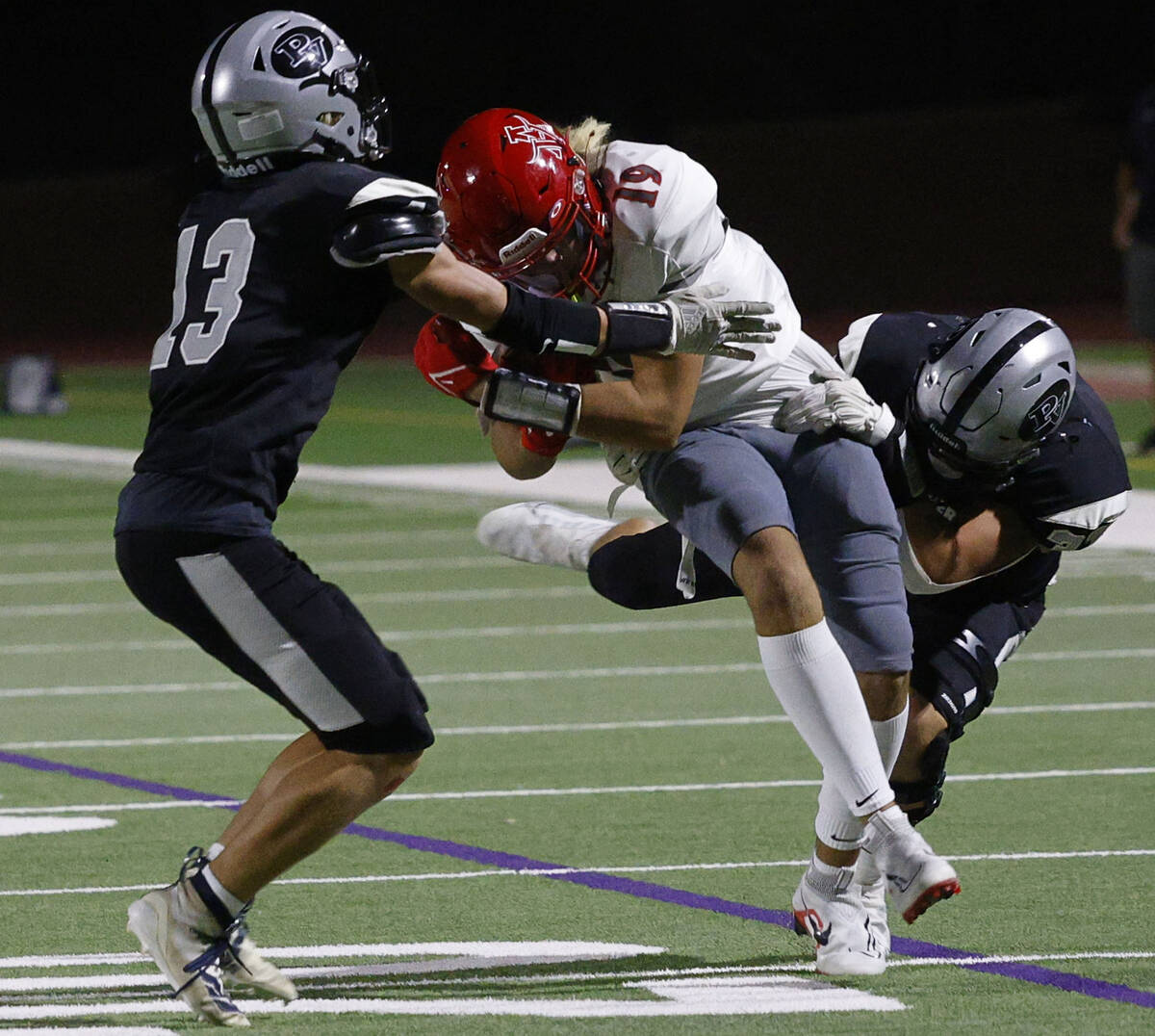 Arbor View’s Jackson Miller (19) is tackled by Palo Verde’s Tommy Gardner (13) a ...