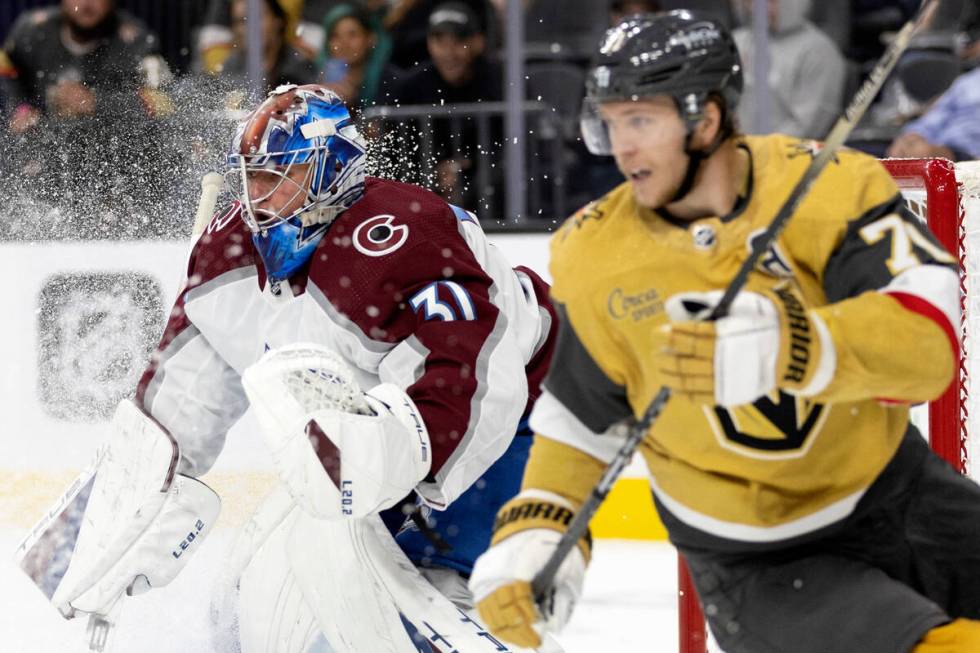 Avalanche goaltender Jonas Johansson (31) and Golden Knights center William Karlsson (71) antic ...