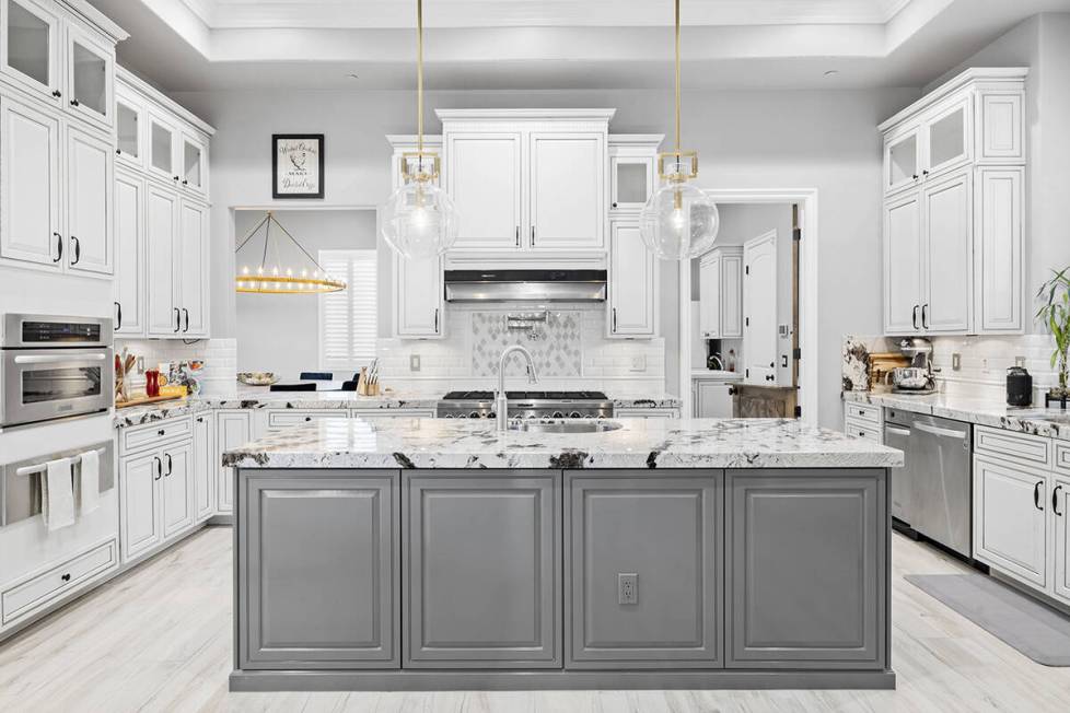 The kitchen features granite countertops. (Napoli Group)