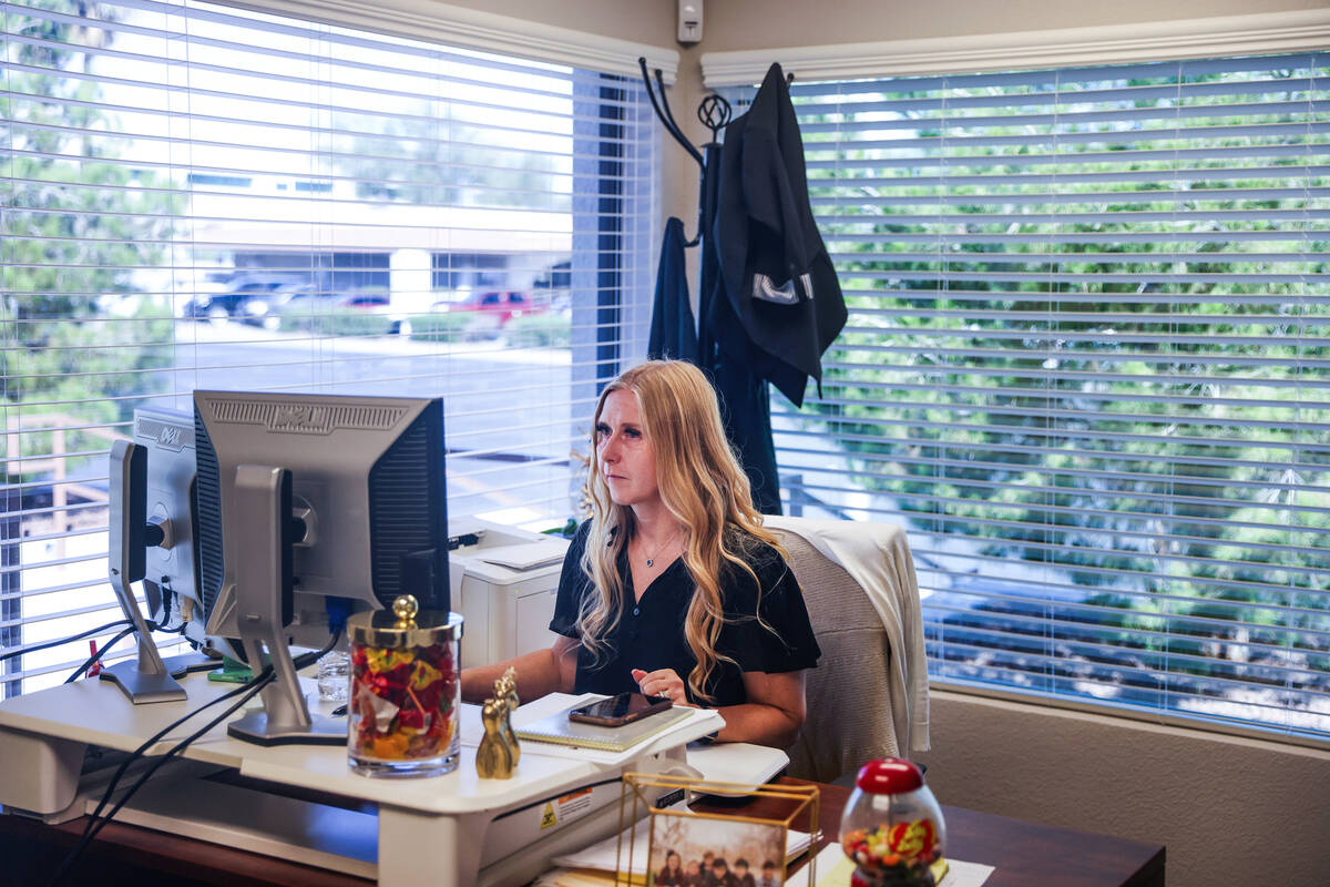Tennille Pereira, director of the Vegas Strong Resiliency Center, works at her computer at the ...