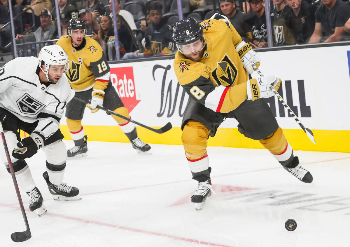 Golden Knights forward Phil Kessel (8) moves the puck under pressure from the Los Angeles Kings ...