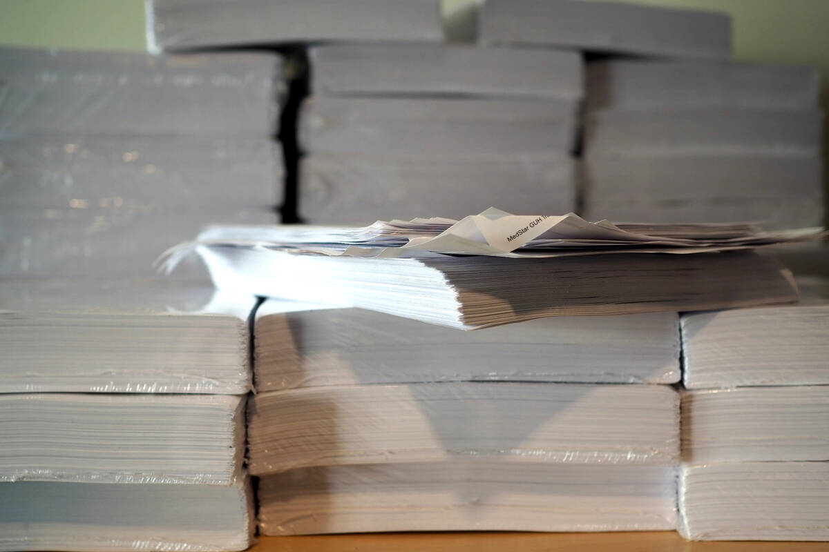 David Confer’s digitized medical records sit in stacks in printed form. Patients have ha ...