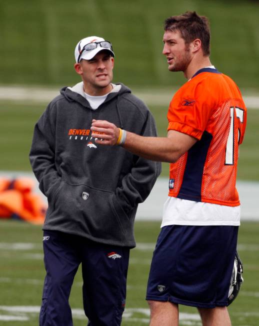 FILE-This April 30, 2010 file photo shows Denver Broncos head coach Josh McDaniels, left, chatt ...