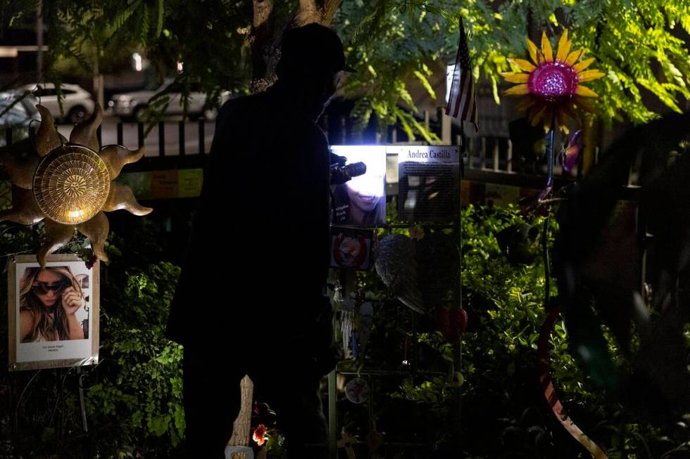 People attend a October 1 Remembrance Ceremony at the Las Vegas Community Healing Garden in Las ...