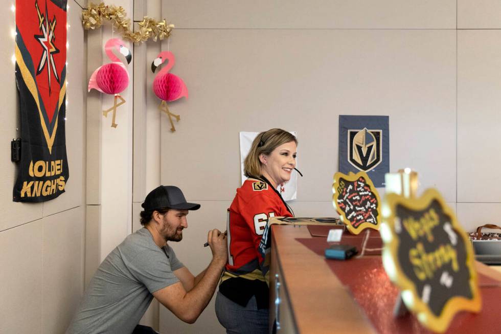 Golden Knights right wing Mark Stone signs the jersey of Kacy Rafferty, a 911 dispatcher, at he ...