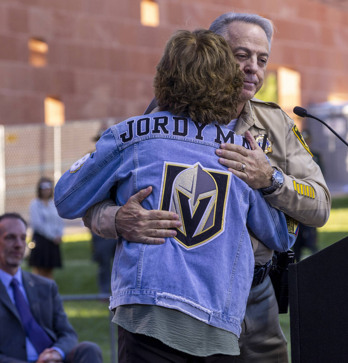 Angela McIldoon hugs Sheriff Joe Lombardo after talking about her son Jordan lost five years ag ...
