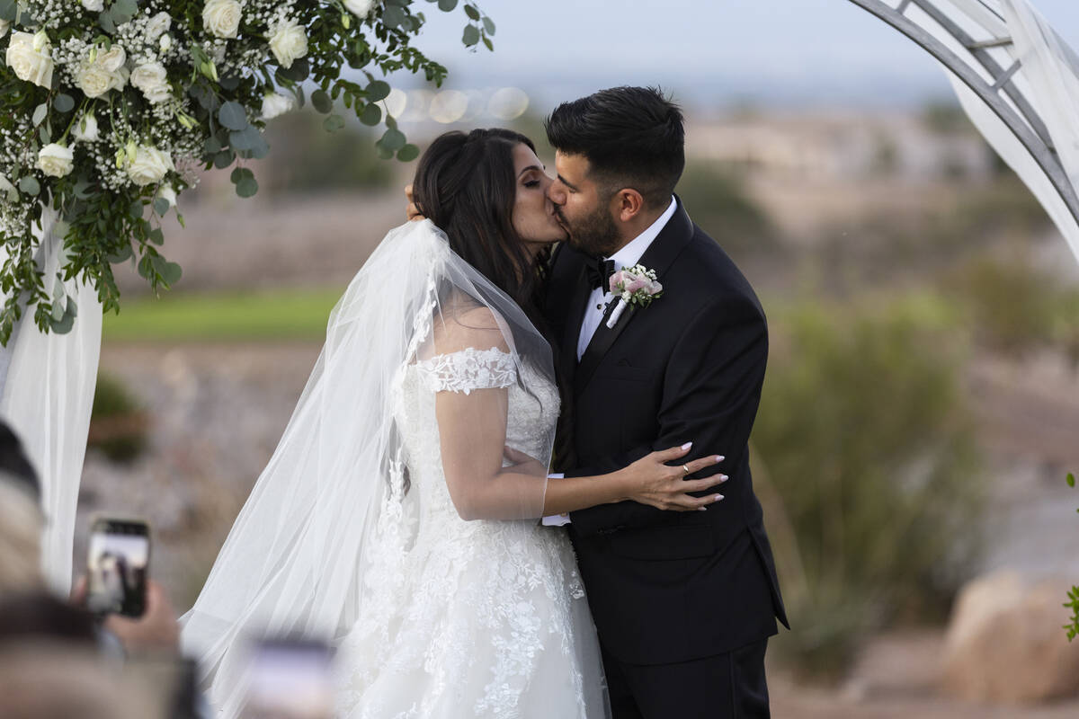 Brittany Castrejon, left, and her husband Jorge Gonzalez-Calvillo, share their first kiss a mar ...