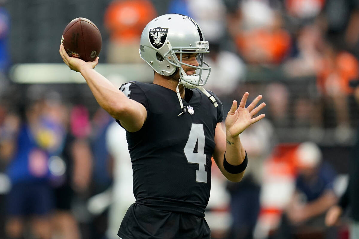 Las Vegas Raiders quarterback Derek Carr (4) warms up prior to an NFL football game against the ...