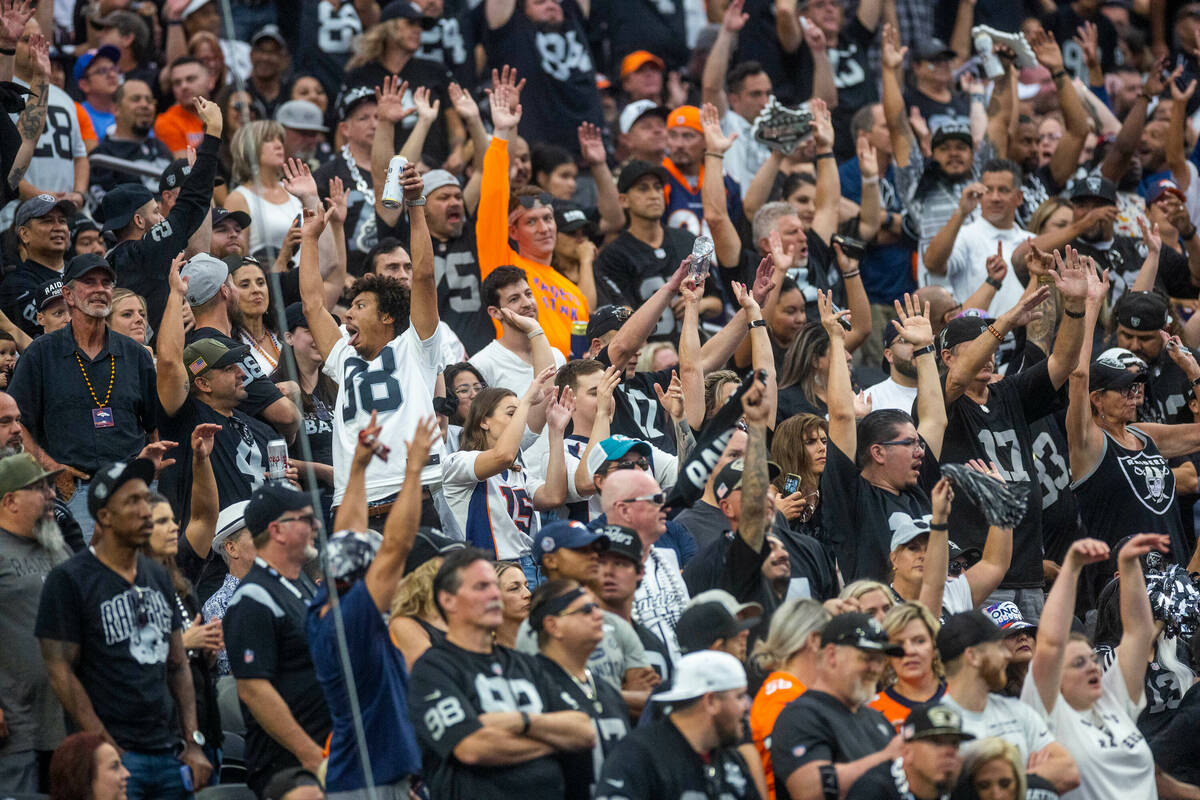 Raiders fans cheer versus the Denver Broncos during the second half of their NFL game at Allegi ...