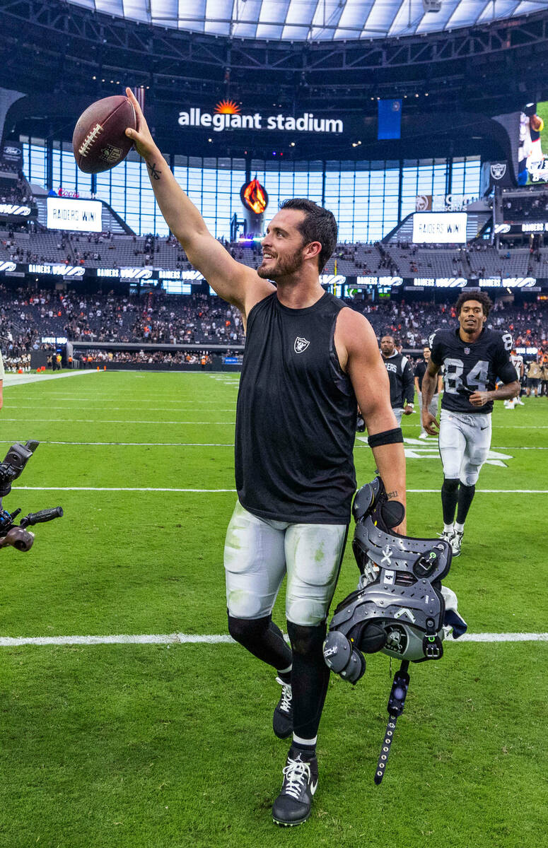 Raiders quarterback Derek Carr (4) celebrates with the fans after defeating the Denver Broncos ...