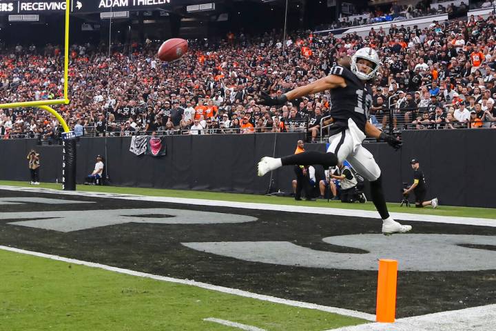 Raiders wide receiver Mack Hollins (10) jumps up to keep the punted ball out of the end zone du ...