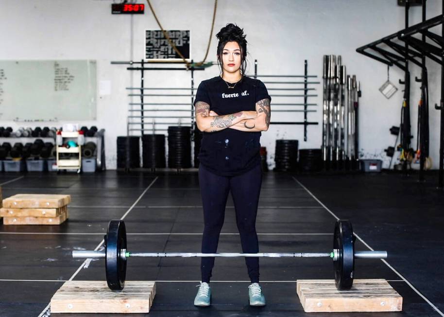 Martinez sports one of Latina Lifters’ signature T-shirts, translated as “Strong AF.” (Ph ...