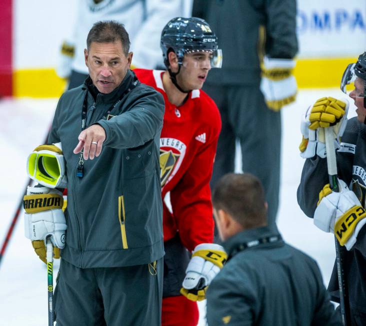 Golden Knights Head Coach Bruce Cassidy, left, addresses his players during practice at City Na ...