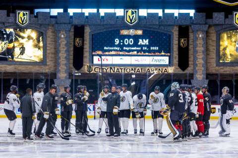 Golden Knights Head Coach Bruce Cassidy, center, addresses his players during practice at City ...