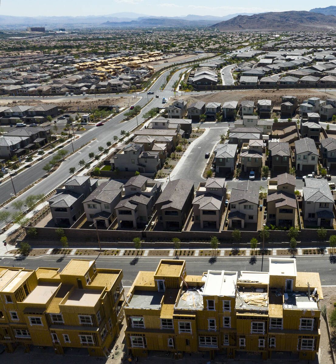 Construction is underway for new development as existing homes are seen from Desert Foothills D ...