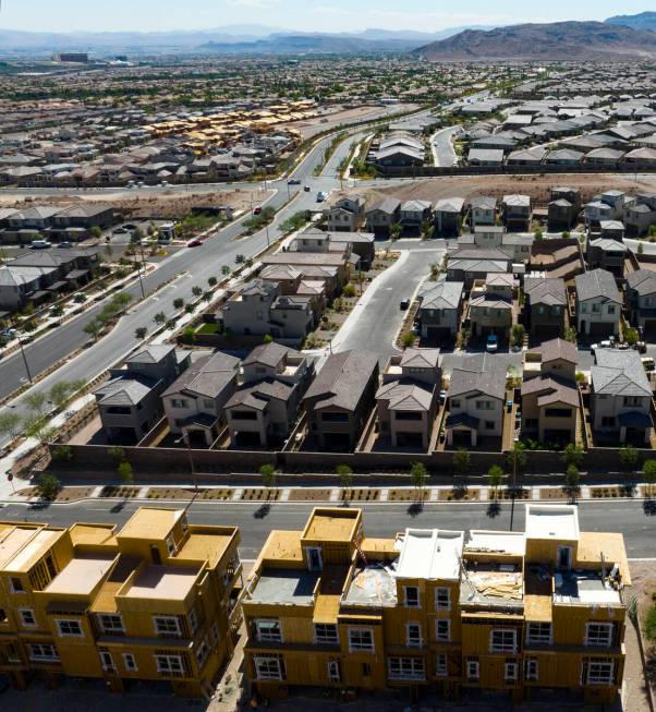 Construction is underway for new development as existing homes are seen from Desert Foothills D ...