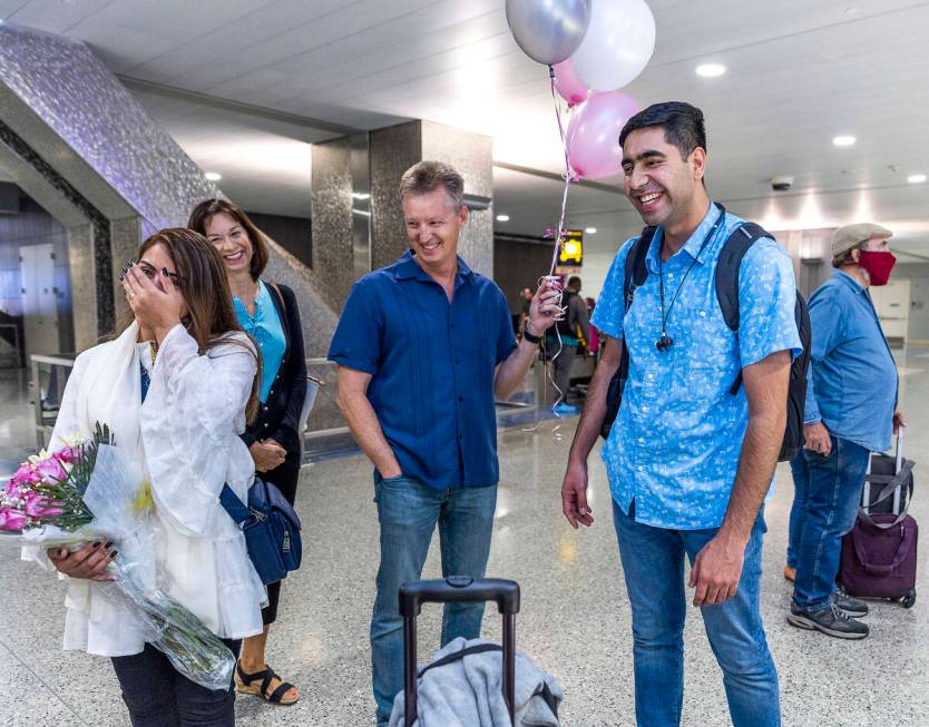 (From left) Shabana is overcome as Ellen and Scott Hoffman welcome her to her new home with hus ...