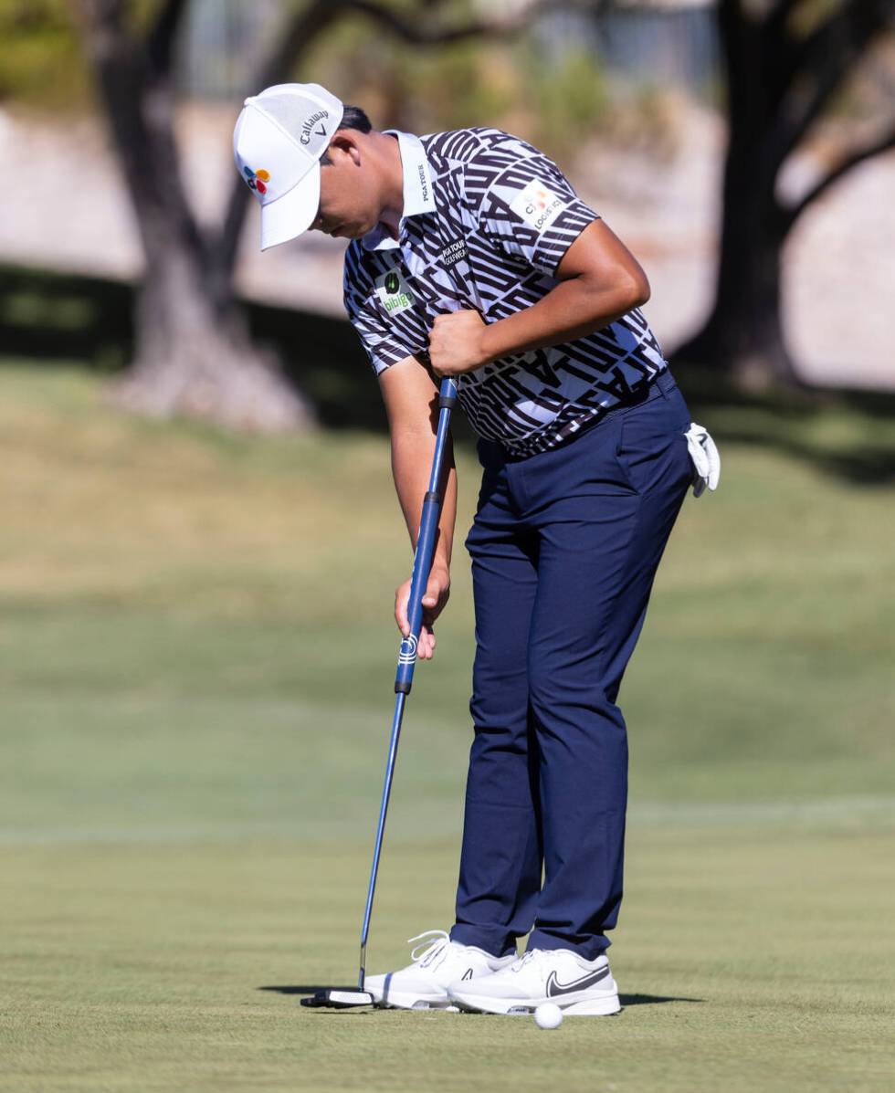 Si Woo Kim of South Korea watches his putt at the second green during the first round of the Sh ...