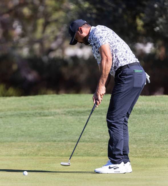 Jason Day, of Australia, watches his putt at the second green during the first round of the Shr ...