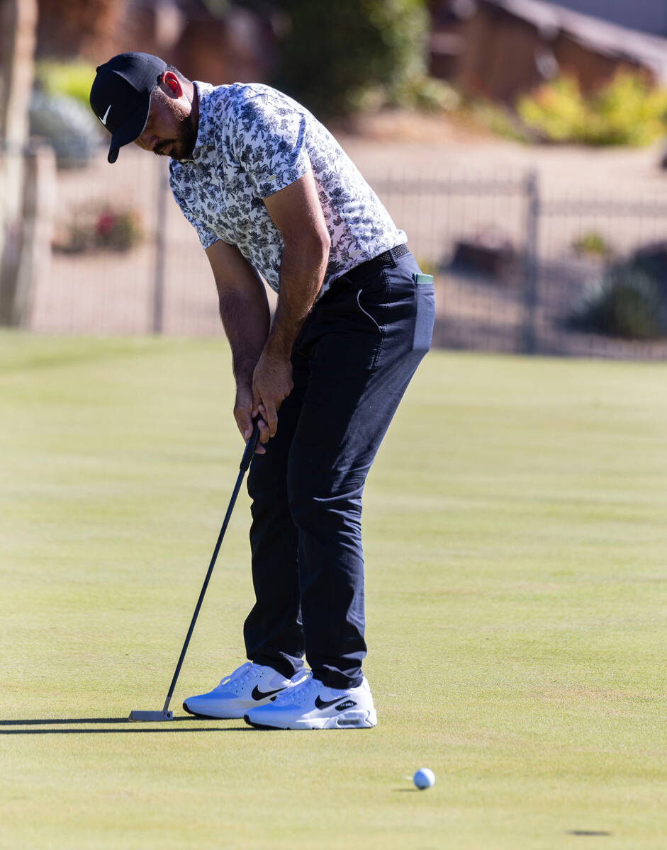 Jason Day, of Australia, watches his putt at the second green during the first round of the Shr ...